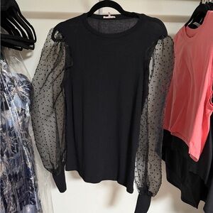 Elegant Black Top with Sheer Polka Dot Sleeves
